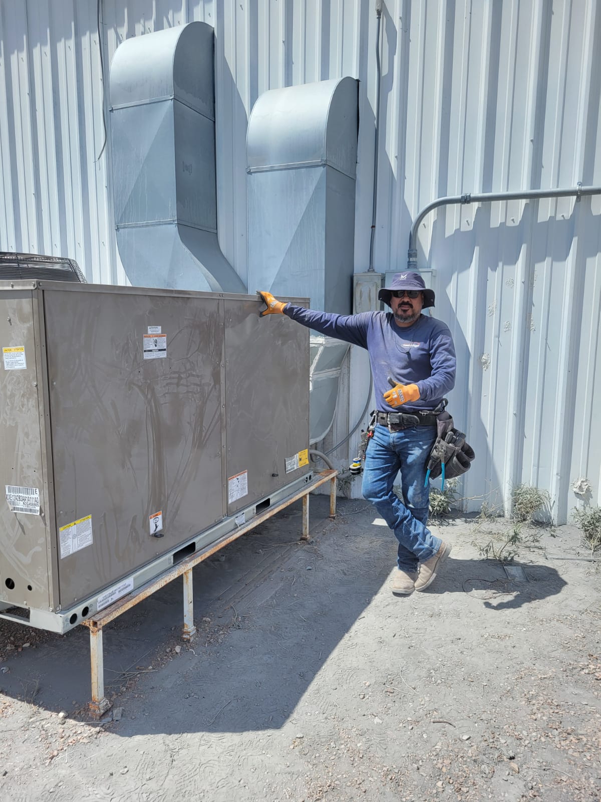 Jorge Lopez, owner of Heating & Air Innovations, on the job